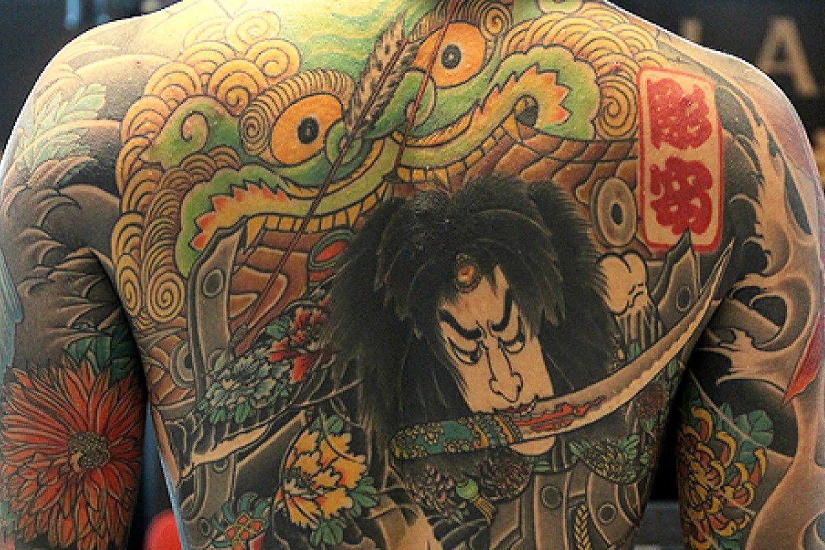Do any real-life Asian mobsters (Yakuza, Triads, Mafia) have tattoos all  over their bodies like the ones seen in movies & TV shows? - Quora